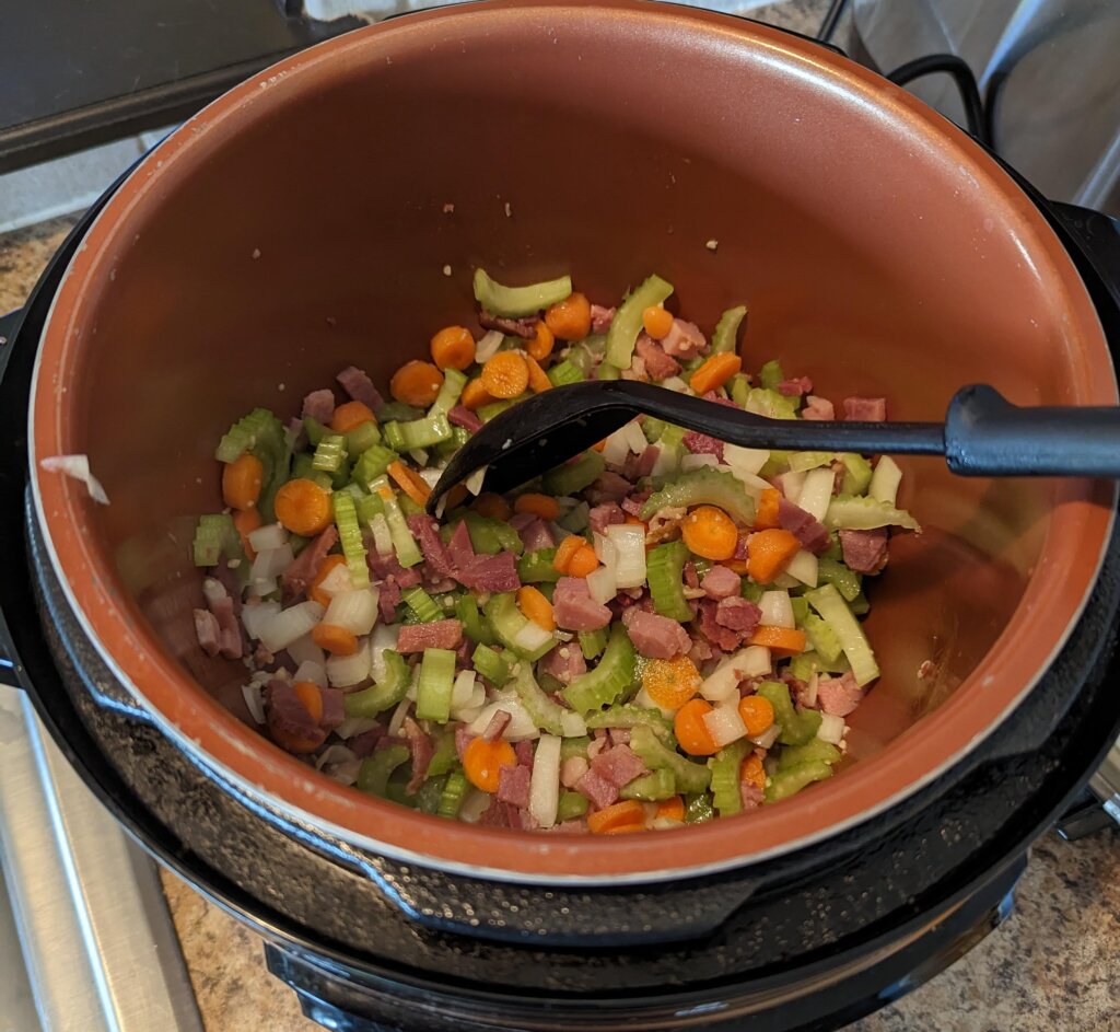 Cook veggies until onions are translucent.