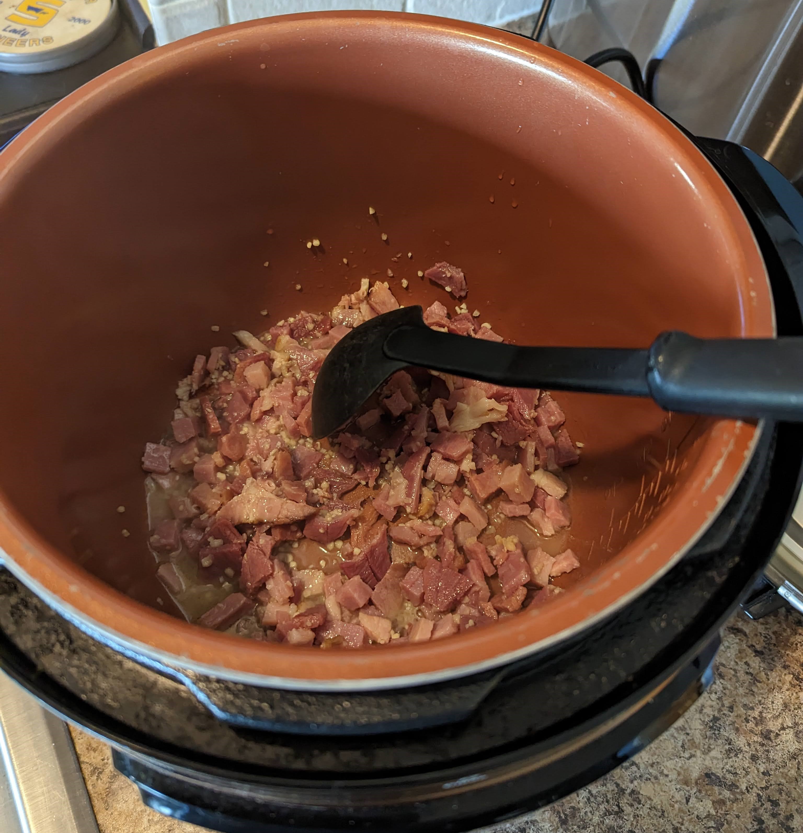 Saute ham and garlic in olive oil.